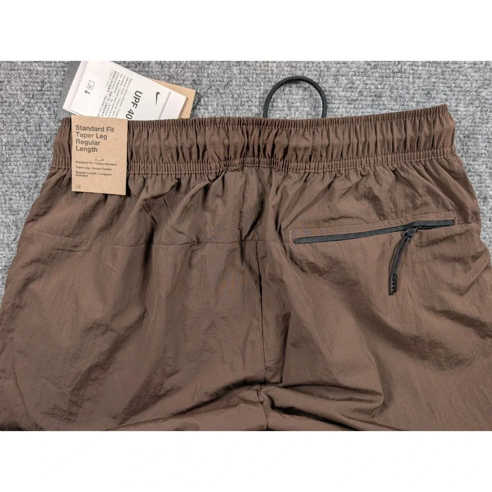 Nike Tech Mens Woven Taper Leg Pants sz Small‎ Brown Performance NWT